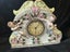 Vintage clock Porcelain Mantle Clock decorated with cherubs and floral motifs Carousel 1