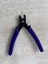 Plier, crimping, steel, purple and black, 5-3/8 inch multi-size tubes. Carousel 2