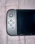NEAR NEW condition Nintendo Switch - black vinyl & comes with case Carousel 6