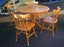 Solid wood Round dining table and chairs very good condition Carousel 1