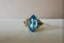Elegant solid 9ct/9k yellow gold & blue topaz ring Carousel 3