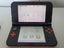 New Nintendo 3DS XL Orange + Black Carousel 7