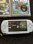 PSP E1002 with 11 games and case Carousel 2