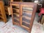 A Vintage Solid Teak Glass Fronted Bookcase or Display Case Carousel 1