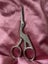 pair of stork embroidery scissors, a common tool in sewing and needlework. Carousel 3