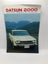 Datsun 2000 deluxe six . Personal six. Standard by Nissan Motor Co Carousel 1