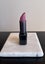 Lipstick sculpture carved in jade, Hematite and fibre optic Carousel 9