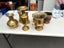 9 x brass coloured vases/ urns: various shapes/ styles incl two pairs (2174AP) Carousel 5
