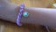 Pink, blue and white loom band bracelet with doughnut charm Carousel 2