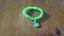 Green and yellow loom band bracelet with hippo charm Carousel 1