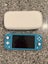 Nintendo Switch Lite with official case Carousel 1