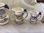 Arnart Blue onion measuring cups 1920s some repairs Carousel 3