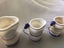 Arnart Blue onion measuring cups 1920s some repairs Carousel 10