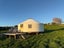 9m Yurt with Custom Circular Floor, fireplace & Front Deck – Ready to Relocate Carousel 2