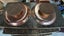 Matching Copper Dishes on Wooden Stands Carousel 3