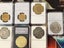 SILVER AND GOLD COINS IN PLASTIC CASES Carousel 9
