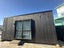 Charred architectural cabin Carousel 7