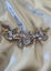 Gold and soft pink floral design hair clip Carousel 1