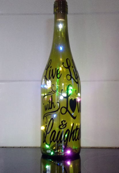 Decorated wine bottle with coloured lights Carousel 1