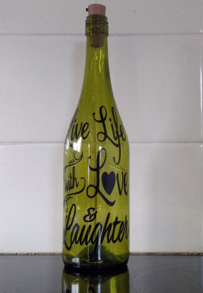 Decorated wine bottle with coloured lights Carousel 2