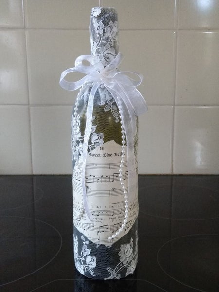 Decorated wine bottle with coloured lights Carousel 1