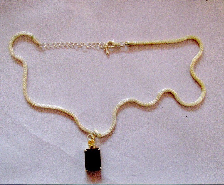 SMOKY TOPAZ COLOURED ZIRCONIA PENDANT c/w SNAKE CHAIN. Carousel 1