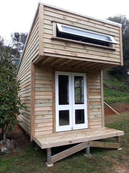 Sleepout Cabin. The Pinnacle Cabin with storage area Carousel 1