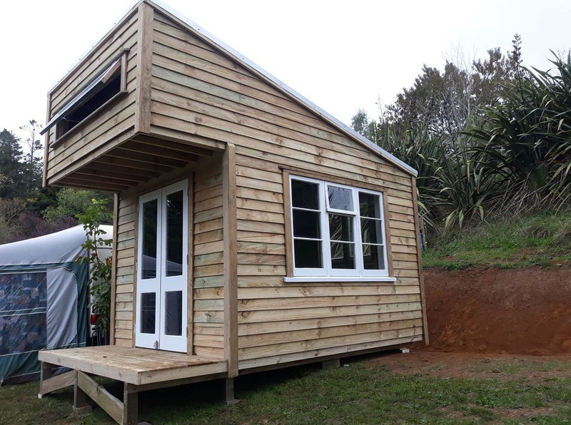 Sleepout Cabin. The Pinnacle Cabin with storage area Carousel 2
