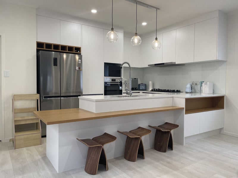 Stunning kitchen with stone benchtop + breakfast bar bench Carousel 1