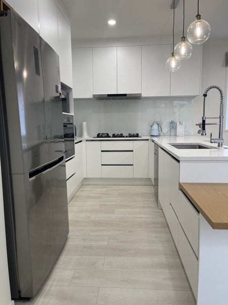 Stunning kitchen with stone benchtop + breakfast bar bench Carousel 2