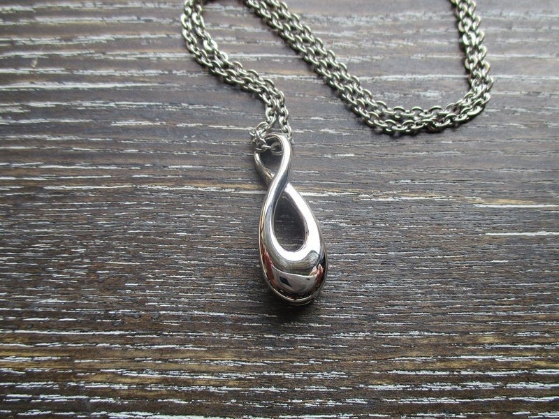 Infinity Memorial Pendant for cremation ash - Stainless Steel Carousel 1