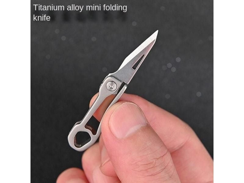 Titanium Alloy Mini Folding Knife Demolition Express Portable Micro Keychain Carousel 1