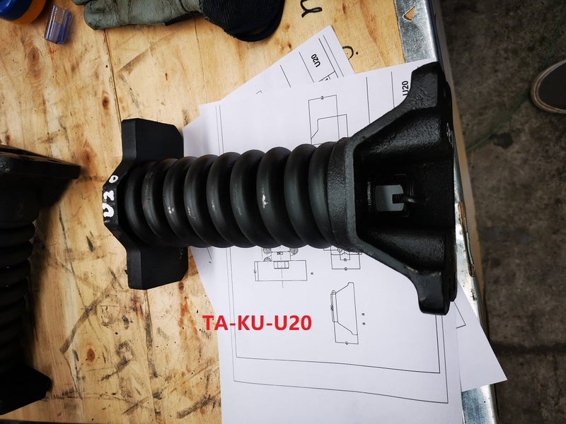 Track Adjuster for Kubota U20 including a spring and a cylinder in Wellsford Carousel 1