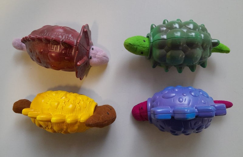 Mighty Dinos toys (McDonalds 1997), set-of-4 dinosaurs, out-of-packet Carousel 1
