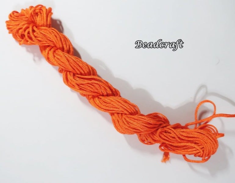 *$1.50 SALE* A 12 mtr. HANK of BRIGHT ORANGE NYLON CORD 2mm Carousel 1