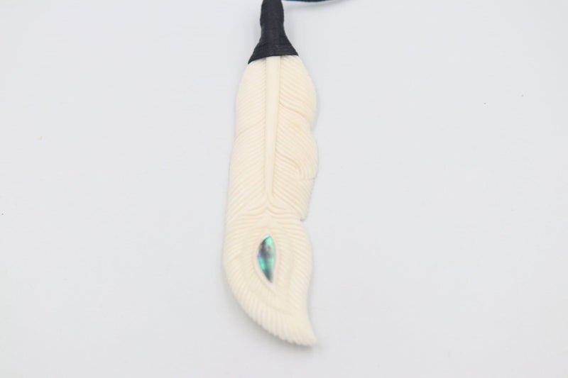 Bound Bone feather pendent with Paua Carousel 1