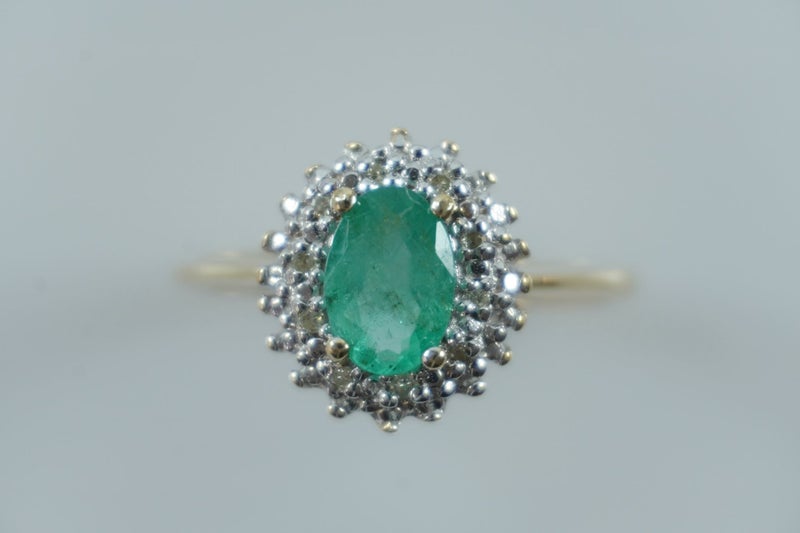 Elegant natural emerald & diamond halo ring in 9ct Carousel 1