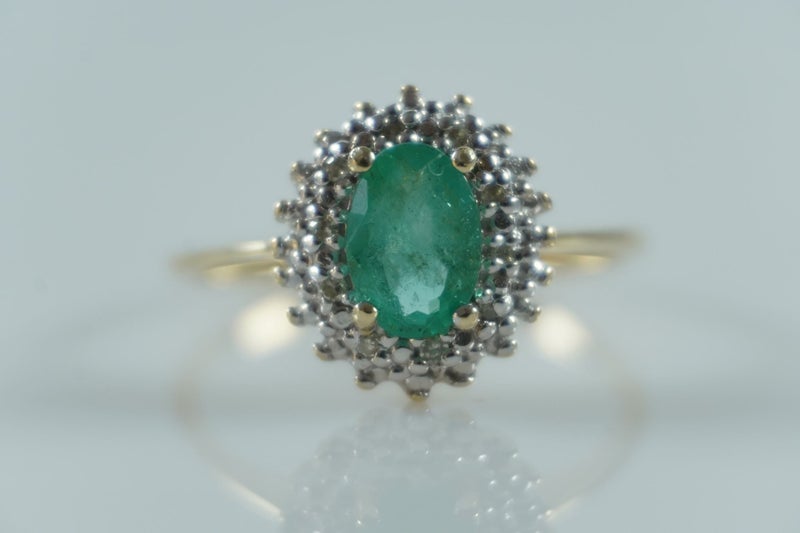Elegant natural emerald & diamond halo ring in 9ct Carousel 2