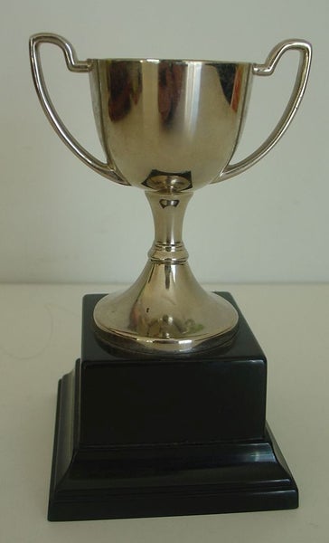 Presentation Cup on Plastic Plinth Base Carousel 1