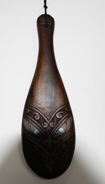 Wooden Patu with Koru Design Carousel 1