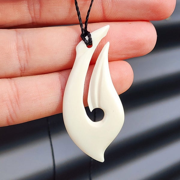 Natural Hand Carved Maori Bone Carving Pendant Necklace - Curved Hook Carousel 1