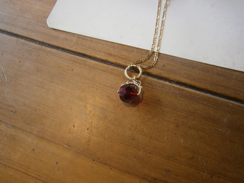 9ct Y.GOLD SPINNER BALL FOB ON 9CT Y. GOLD CHAIN (11.6gms) Carousel 2