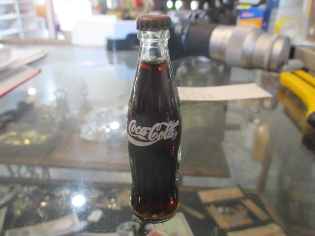 COCA COLA MINIATURE GLASS BOTTLE. SEALED Carousel 1