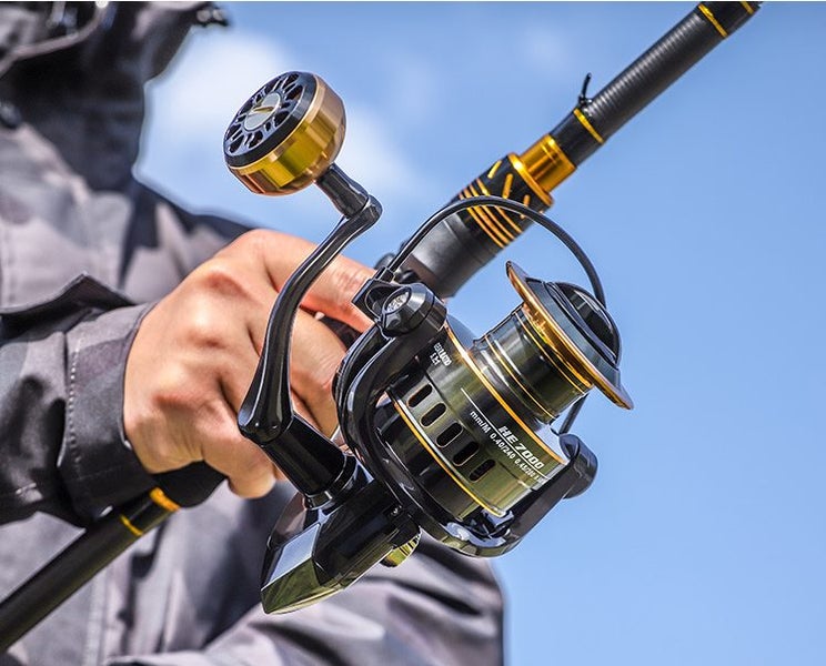 HE7000 Metal Spinning Fishing Reel Left/Right Retrieve 5.2:1 12 Ball Bearings Carousel 1