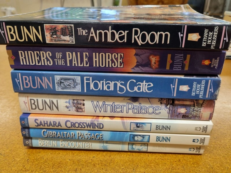 T. Davis Bunn books x 7 Carousel 9