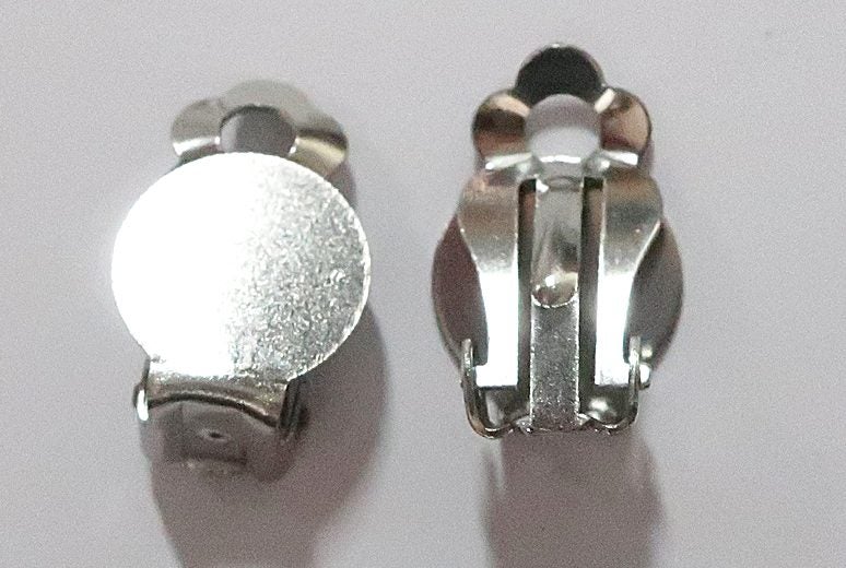 A PAIR STAINLESS STEEL CLIP ON EARRINGS Carousel 1