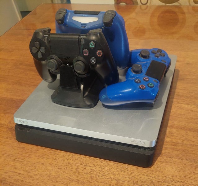 PS4 Slim 1TB Console Plus Controllers Charging Dock Carousel 1
