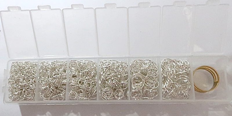 CONTAINER of BRIGHT SILVER JUMP RINGS 4-10mm Carousel 1