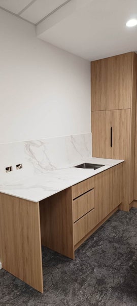 Woodgrain Reception - Kitchen Cabinet,bench top design and installation Carousel 5