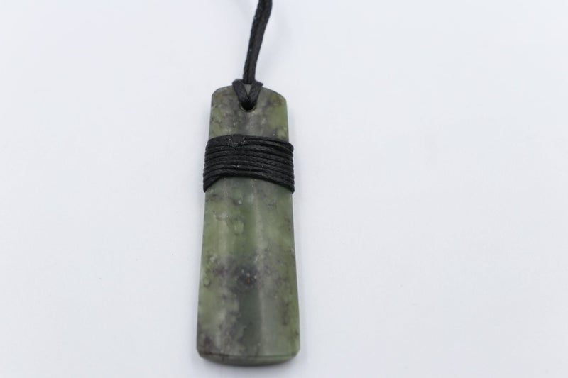 New Zealand Greenstone Wrapped Toki Carousel 1